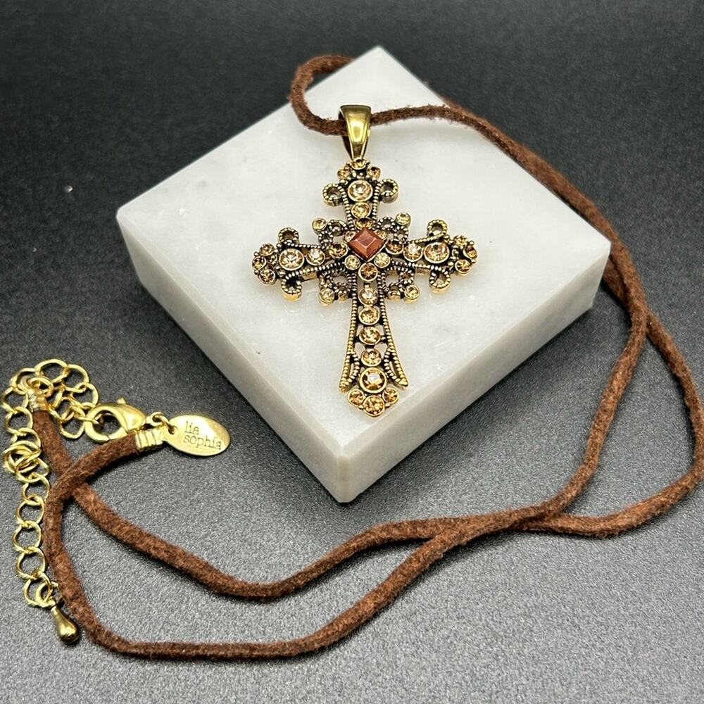 L0065 Lia Sophia Cross Pendant Necklace gold tone brown cord